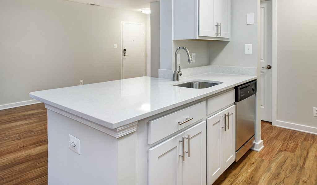 Open-concept kitchen with breakfast bar and granite-style countertops at Stonecreek Club in Germantown, MD