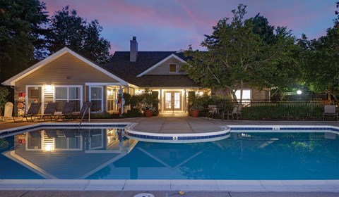 Apartment swimming pool with patio lounge chairs at Windsor Park in Woodbridge VA