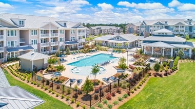 Aerial view of The Highland apartment community with resort-style swimming pool and amenities in Augusta, GA