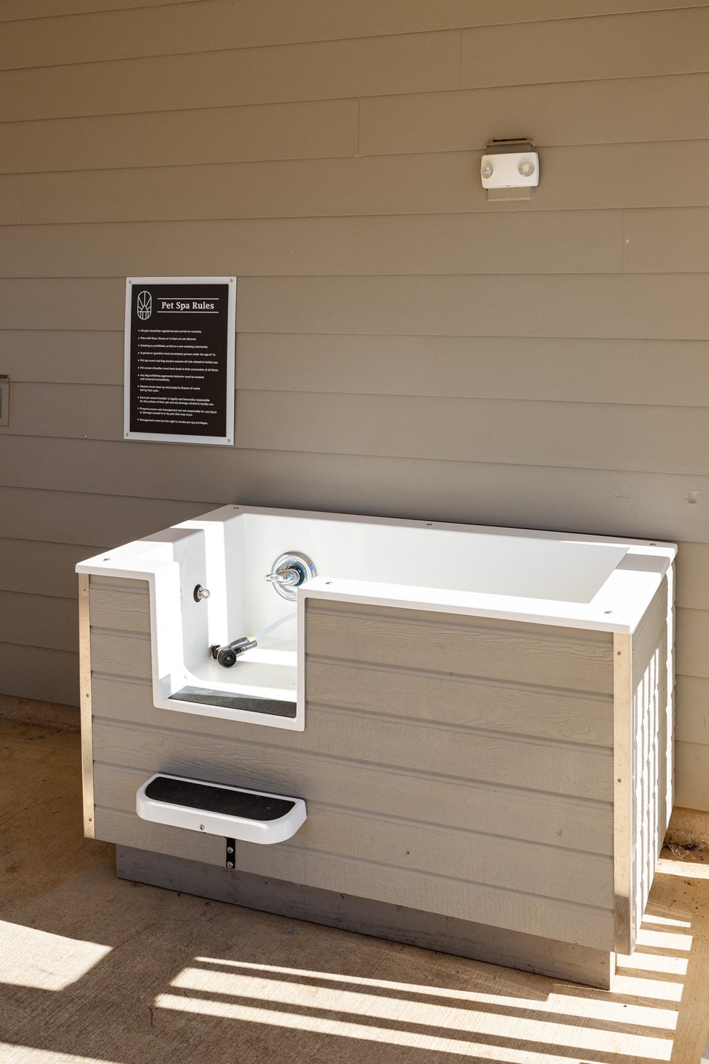 Pet washing station with concrete flooring at The Alexandria in Madison, AL Pet washing station with concrete flooring at The Alexandria in Madison, AL