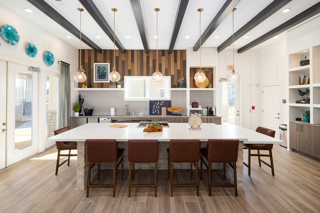 Madison communal kitchen with bar-style seating and wood-designed flooring at The Alexandria Madison communal kitchen with bar-style seating and wood-designed flooring at The Alexandria