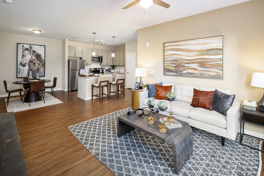 Madison, AL furnished living room with a sofa, two nightstands and wood-designed flooring at The Alexandria