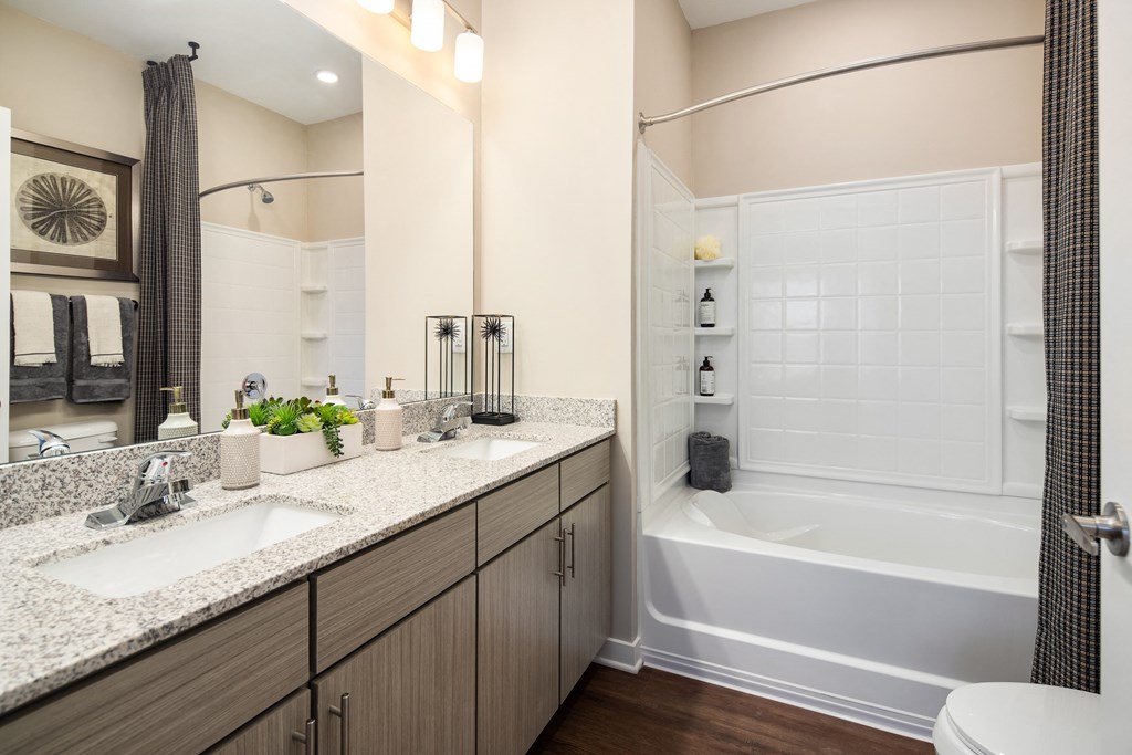 Full bathroom with shower/tub combo and granite countertops at The Alexandria in Madison, AL