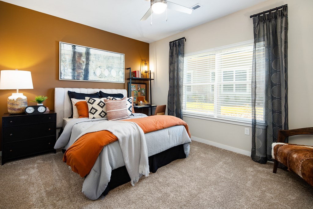 Entry of an apartment with built-in shoe bench and high ceiling at The Alexandria in Madison, AL