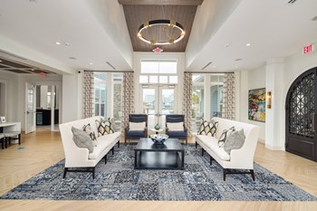 Interior of the leasing office and clubhouse with ample seating at The Highland in Augusta, GA - Photo Gallery 6