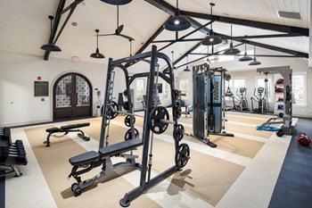 Premium fitness center with free weights and strength machines at The Highland in Augusta, GA - Photo Gallery 15