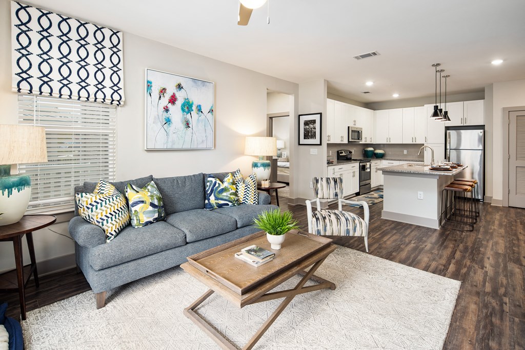 Living room with wood-designed flooring at The Highland in Augusta, GA