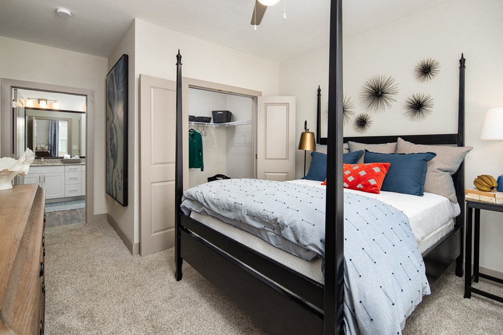 Bedroom with walk-in closet and private bath at The Highland in Augusta, GA