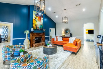 Resident clubhouse with high ceilings, fireplace and ample seating at The Reserve of Byram in Byram, MS - Photo Gallery 3