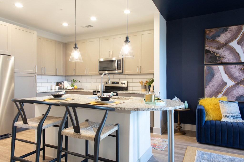Chef-inspired apartment kitchen with subway title backsplash at Foundry Yards in Birmingham, AL