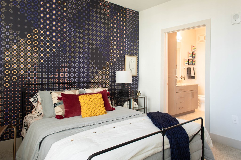 Apartment bedroom with view of bathroom at luxury Foundry Yards community in Birmingham