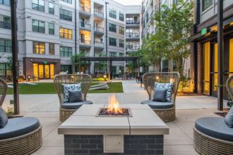 Birmingham, AL Apartment building fire pit and cozy seating at Foundry Yards - Photo Gallery 1