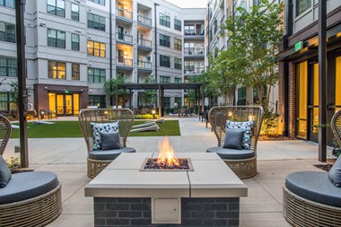 Birmingham, AL Apartment building fire pit and cozy seating at Foundry Yards