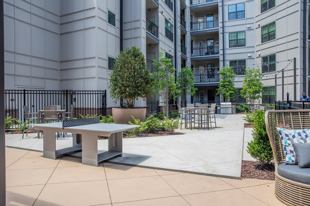 Foundry Yards apartment community outdoor space with ping pong tables and grilling stations.