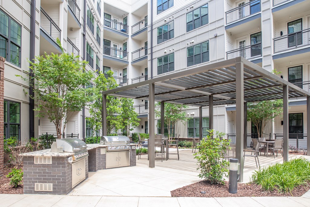 Grills and apartment outdoor courtyard in Birmingham, AL at Foundry Yards
