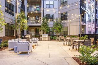 Foundry Yards apartment building outdoor community space with kitchen and grilling station - Photo Gallery