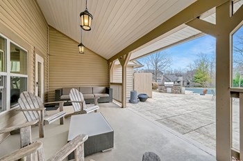Clubhouse patio with covered seating at Hunt Club apartments for rent - Photo Gallery 15