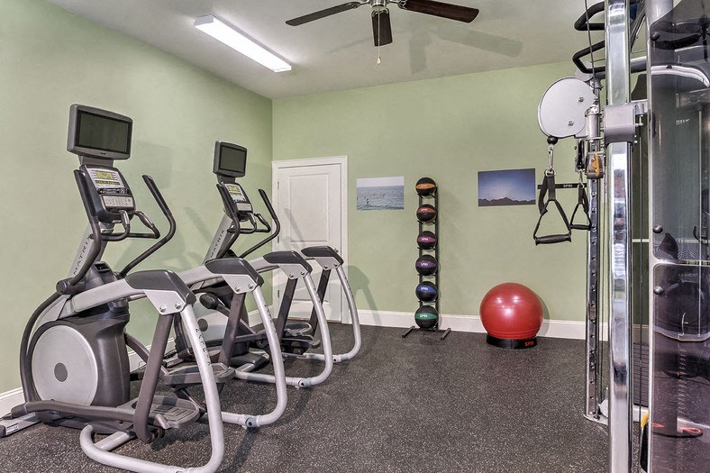 Elite fitness center with exercise equipment at Retreat at the Park apartments for rent
