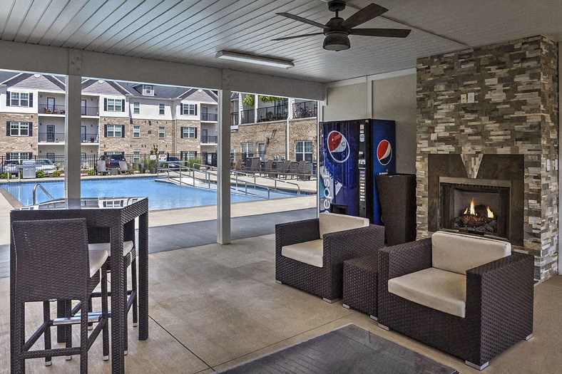 Clubhouse with seating and a soda machine at Retreat at the Park apartments for rent in Burlington, NC