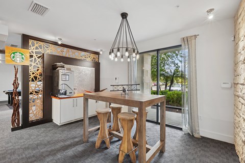 A dining area with a wooden table and chairs.