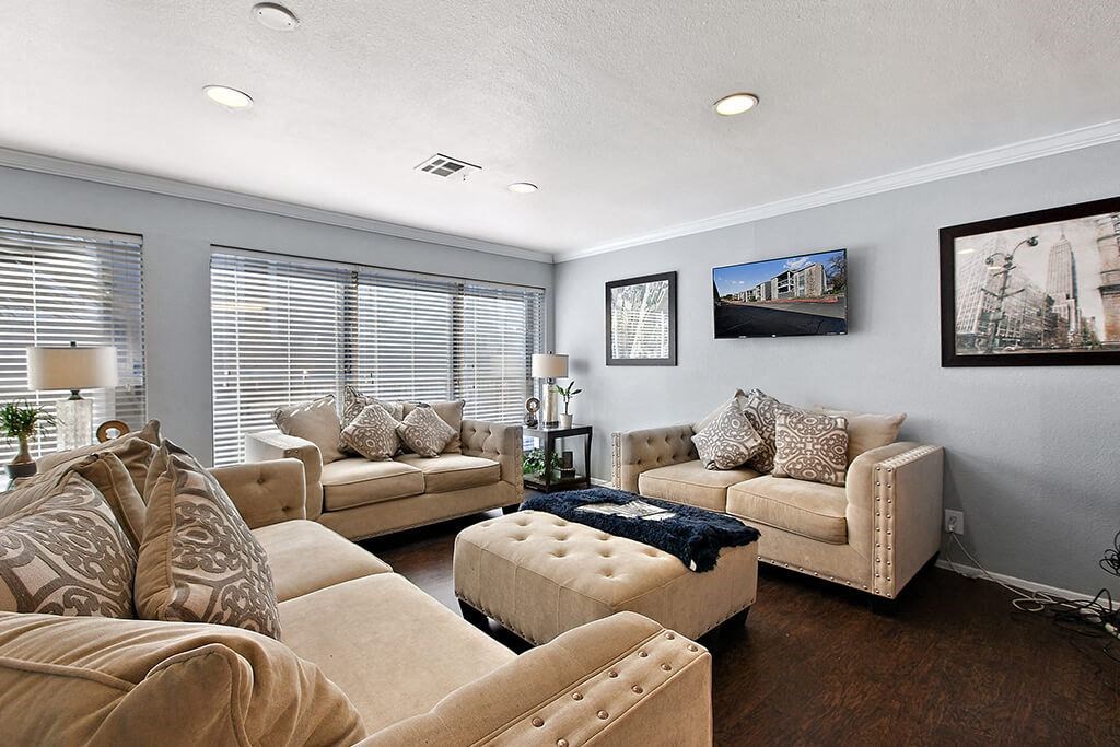 a living room with couches and a table