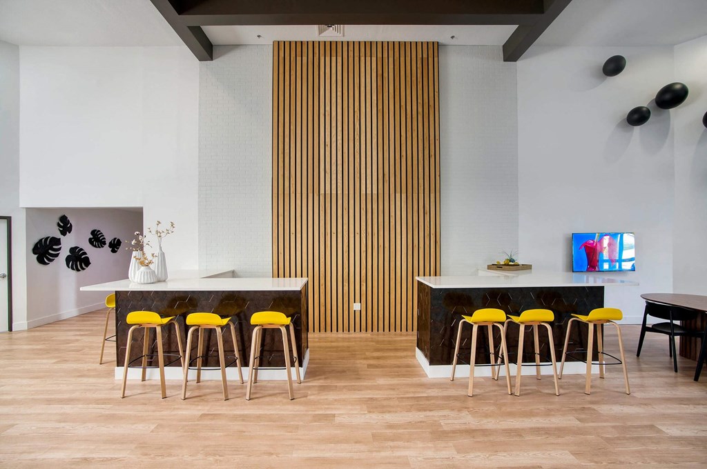 a clubhouse room with chairs and a table at Presidio Palms Apartments, Tucson, 85701