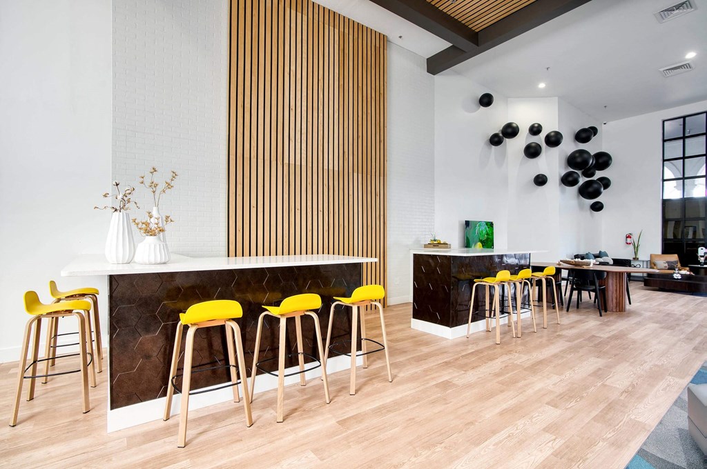 a clubhouse room with a chairs and wooden table at Presidio Palms Apartments, Tucson, AZ, Arizona , 85701