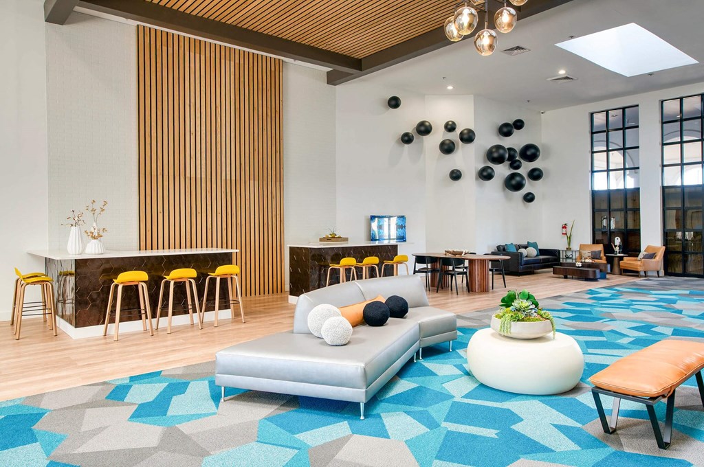 Lobby area with a couch and a bar at Presidio Palms Apartments, Tucson, AZ, 85701