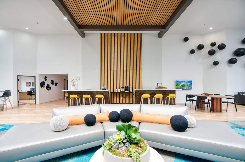 the lobby or reception area of a hotel with couches and tables at Presidio Palms Apartments, Arizona, 85701