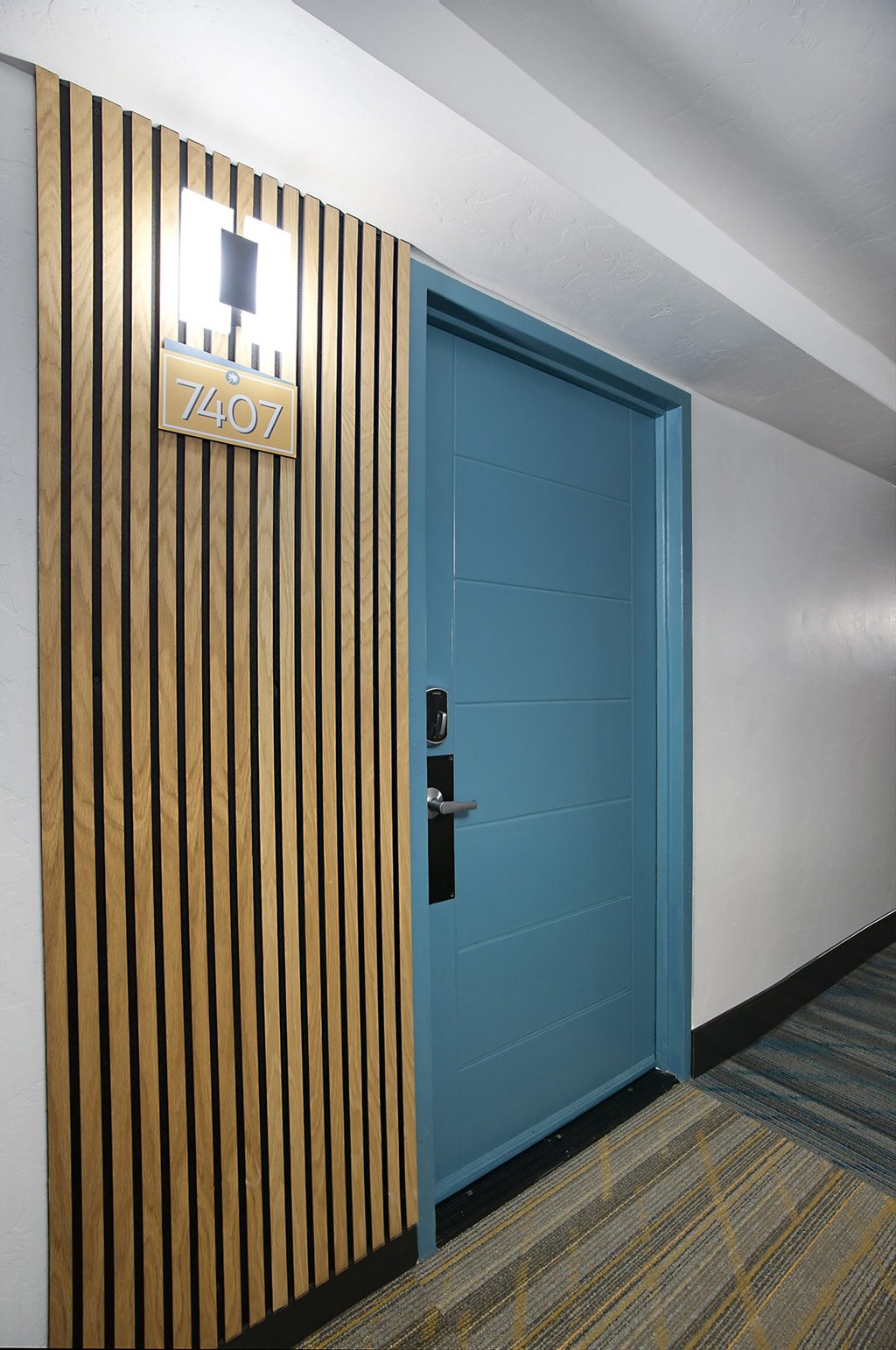 A blue door leading to a unit at Presidio Palms Apartments, Arizona