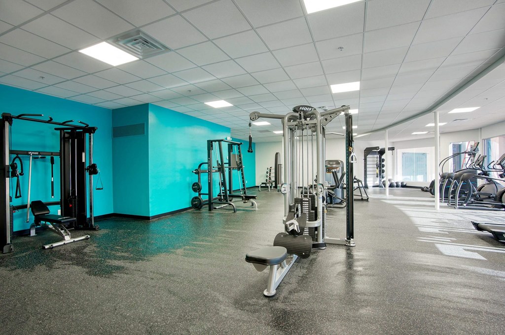 a gym with weights and cardio equipment at Presidio Palms Apartments, Tucson, 85701
