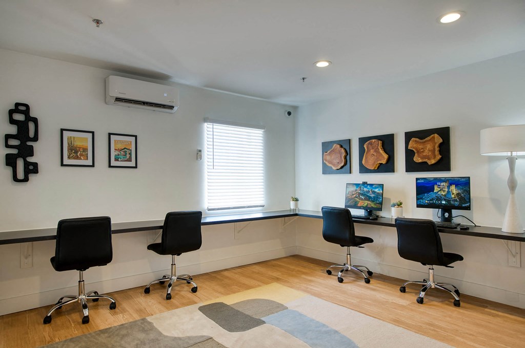 an office with four chairs and a desk and a window at Presidio Palms Apartments, Tucson, AZ, 85701