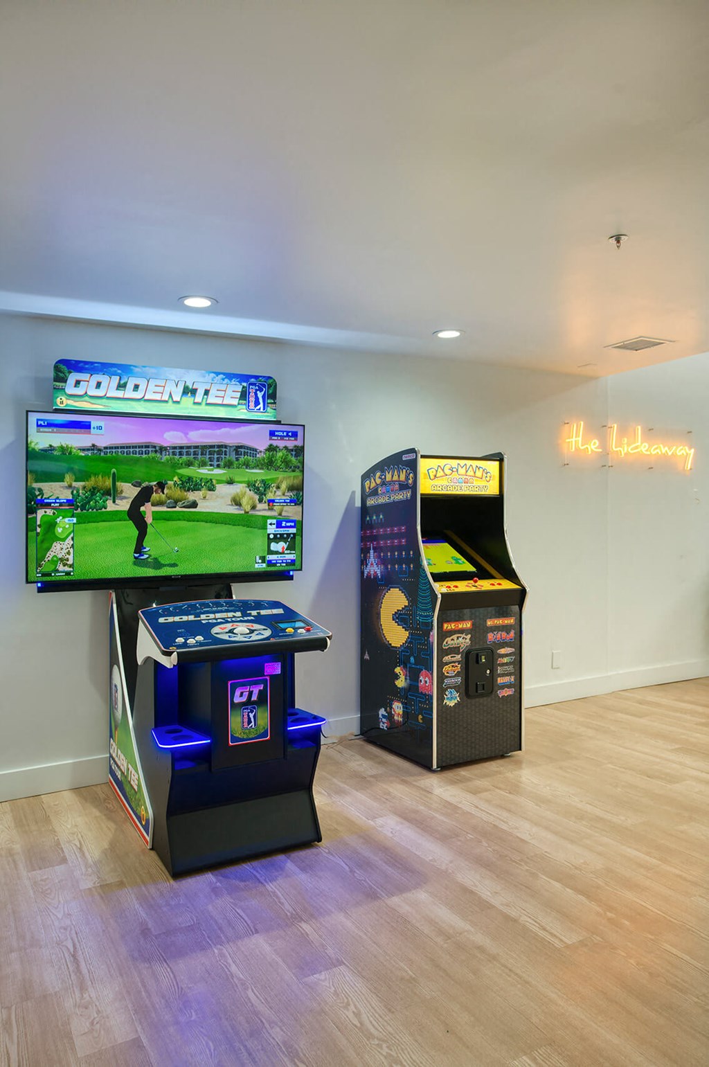 the game room has video games and a large screen tv at Presidio Palms Apartments, Arizona