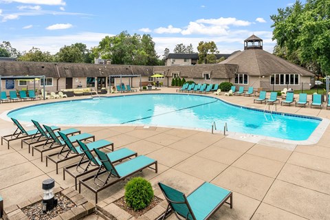 large outdoor pool with lounge chairs