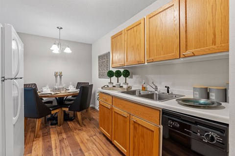 kitchen with wood cabinets and dining room