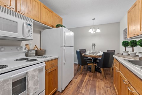 kitchen and dining room with white fridge