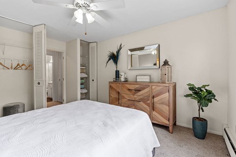 bedroom with bed and mirror