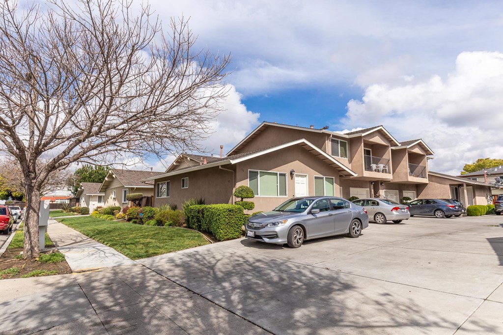 a house with cars parked in front of it