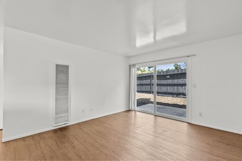 A living room with sliding doors to patio