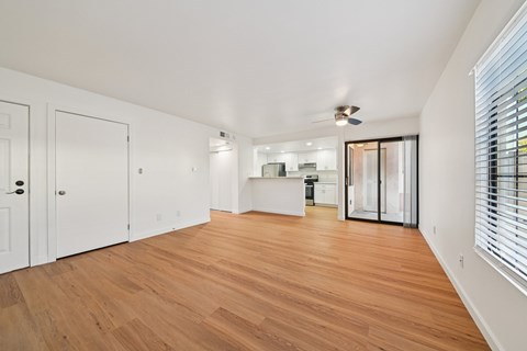 A room with wooden floors and white walls.