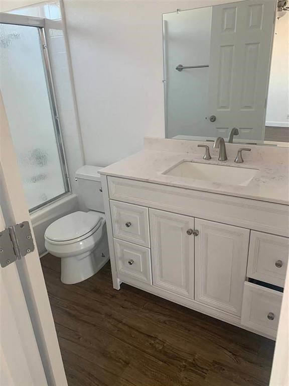 a bathroom with a sink toilet and a mirror
