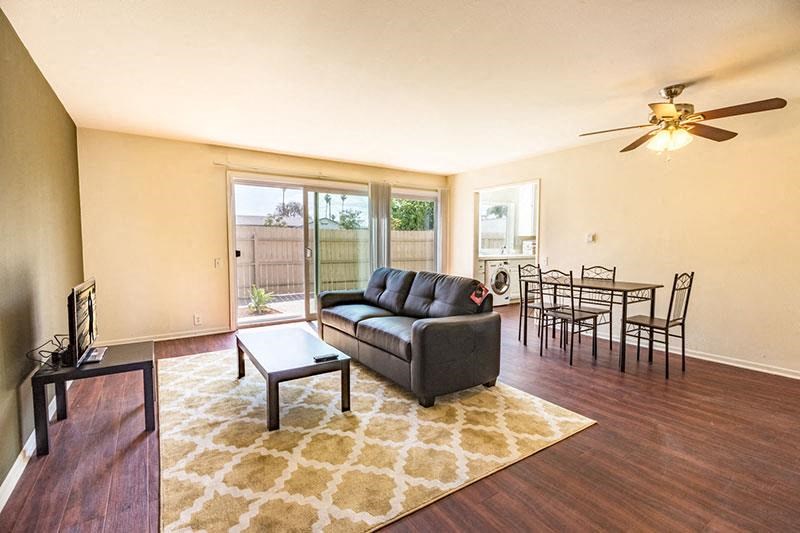 living room and dining room combo with doors to patio