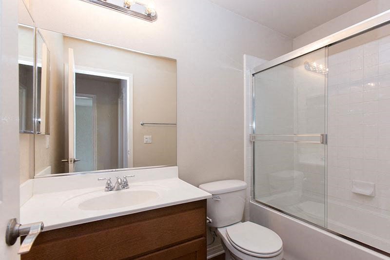 a bathroom with a sink toilet and a shower