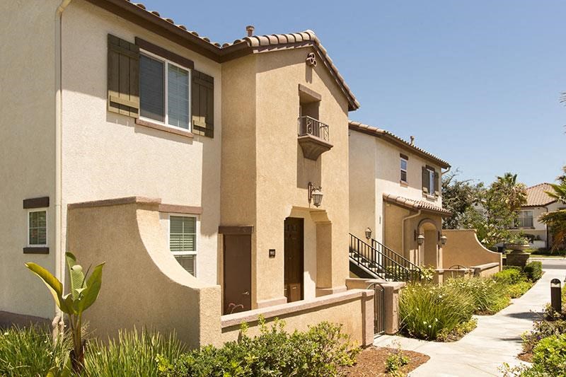 a house with a sidewalk in front of it