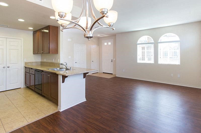 an empty kitchen with an island in the middle