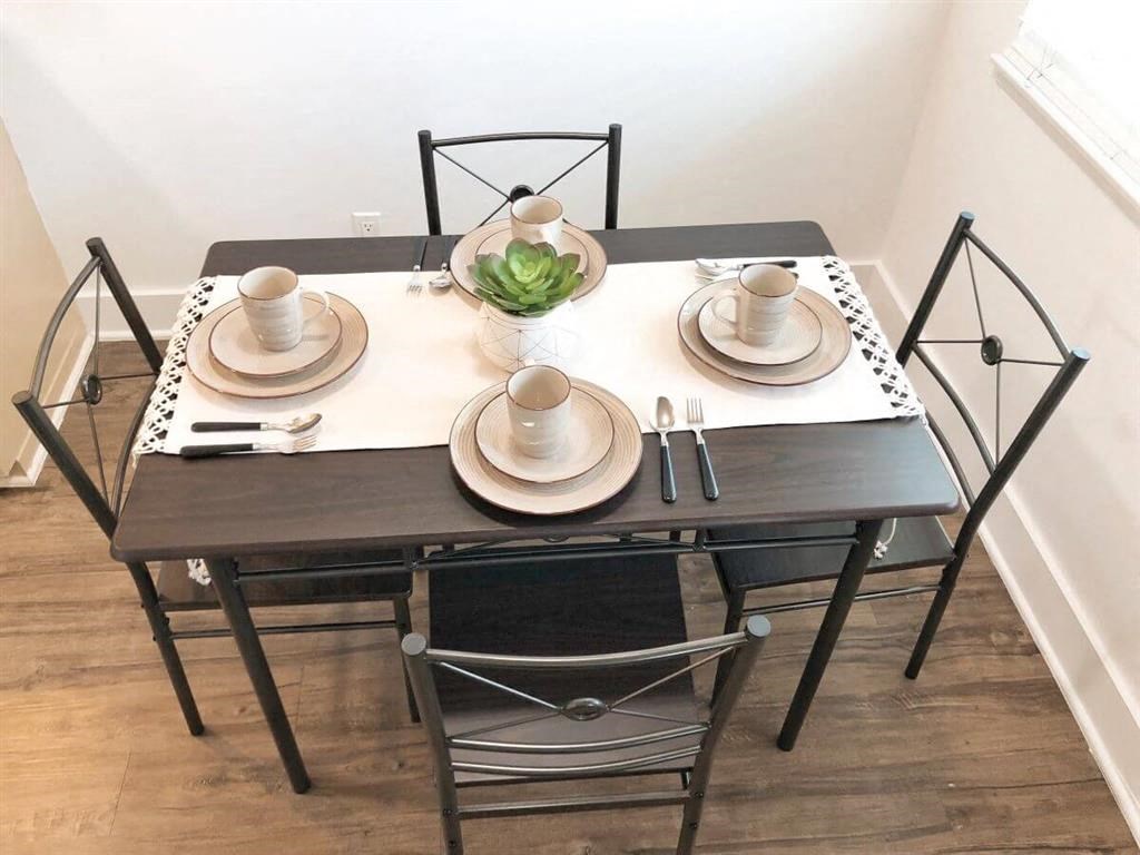 a dining room with a table and chairs