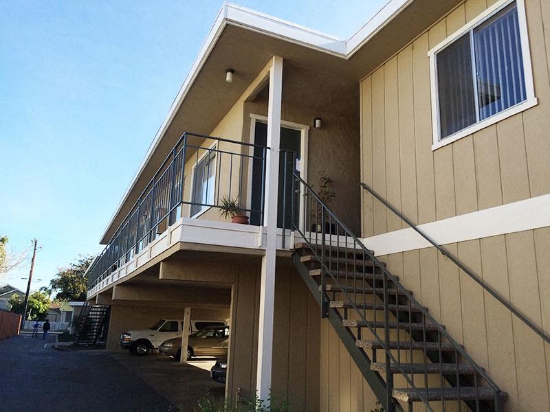 a building with a staircase and a balcony