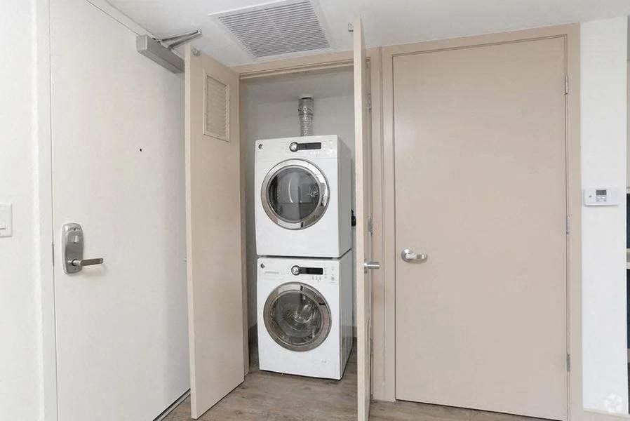 stacked washer and dryer in unit