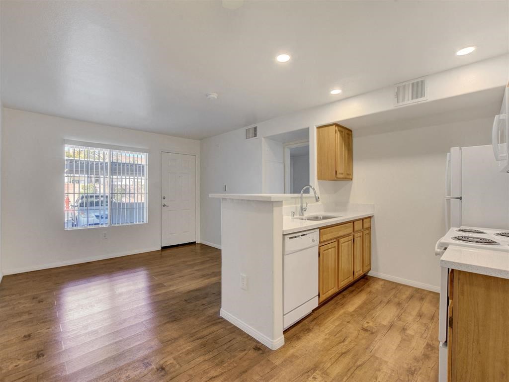a kitchen with an island and a stove top oven