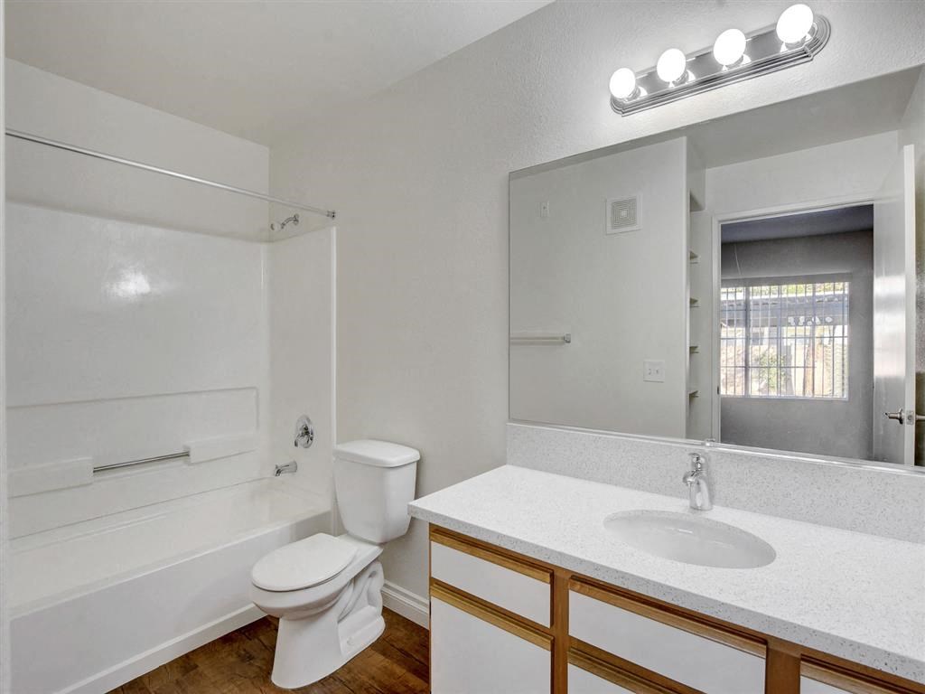 a bathroom with a toilet sink and bathtub